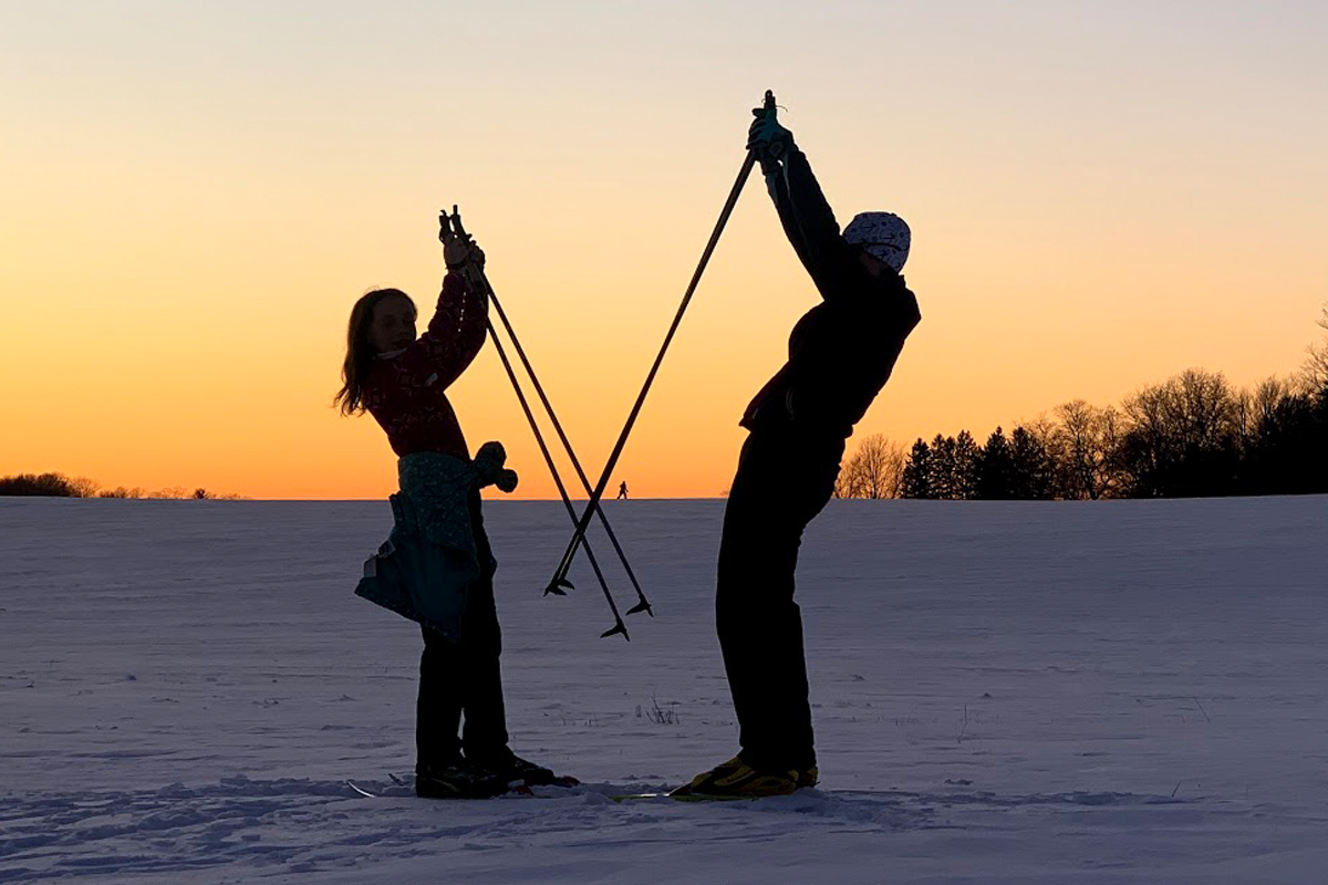 Skiers in the sunset
